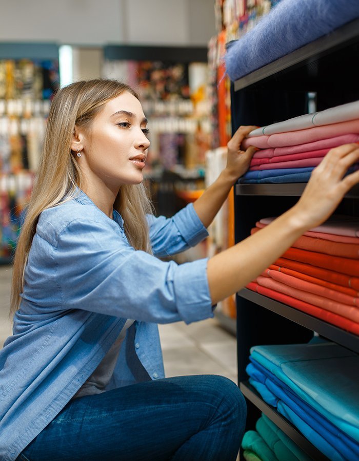 Saleswoman Measures Fabric In Textile Store Z5w4b3b.jpg